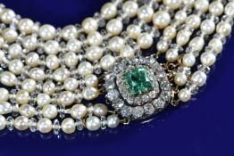 A four strand necklace of graduated natural saltwater pearls and colourless crystal rondel-shaped