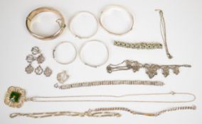A collection of silver jewellery including two bangles, three christening bangles, Greek Key