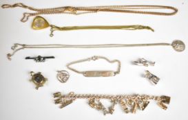 A rolled gold guard chain, silver and paste brooch, two silver St Christophers, silver bracelet,