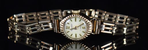 Rotary 9ct gold ladies wristwatch with gold hands and hour markers, silver dial and 17 jewel