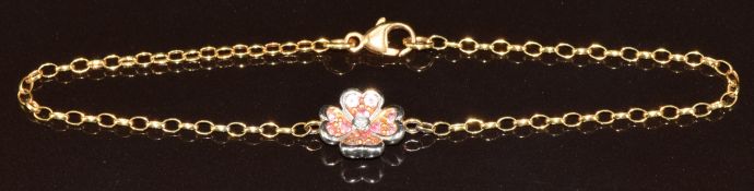 An 18ct gold bracelet in the form of a flower set with a diamond surrounded by amethysts, 3.4g, 18.