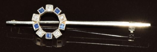 An 18k white gold brooch set with sapphires and diamonds