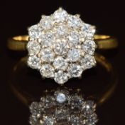 An 18ct gold ring set with a cluster of diamonds, the total diamond weight approximately 1ct, 4.