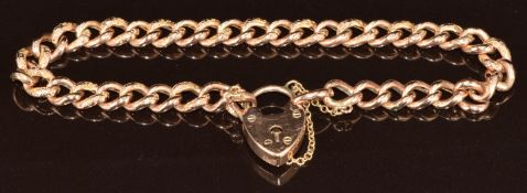 A 9ct rose gold curb link bracelet with engraved links and heart padlock clasp, 8.6g, 18.5cm