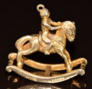 A 9ct gold charm in the form of a rocking horse, 5.3g, 2.2cm