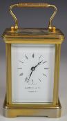 Garrard brass cased bevelled glass carriage clock, height including handle 15.5cm