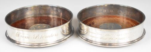 Pair of modern feature hallmarked silver wine bottle coasters, London 2004, maker Links of London,