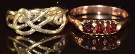 A 14k rose gold ring set with garnets (2.4g, size N) and a 9ct gold ring (1.4g, size M)