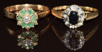 Two 9ct gold rings, one set with a diamond surrounded by emeralds and the other an oval cut sapphire