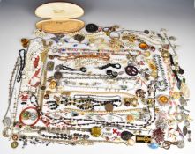 A collection of jewellery including three Victorian jet brooches, one set with seed pearls, other