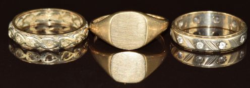 Three 9ct gold rings, two eternity rings and one signet ring, 8g, size L, M & N