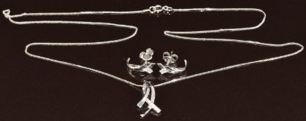 A 9ct white gold pendant set with diamonds, on 9ct white gold chain with matching earrings, 2.4g