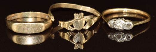 Two 9ct gold rings (2.1g, band cut) and an 18k gold ring set with two diamonds (1.5g, one diamond
