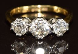 An 18ct gold ring set with three diamonds of approximately 0.6, 0.32 and 0.3ct, the total diamond