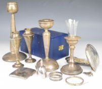 Hallmarked silver items to include three candlesticks, pair of vases, cigarette case, bangle, napkin