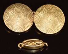A yellow metal engine turned cufflink (5.4g) and a 15ct gold clasp (0.8g)