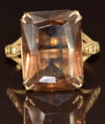 A 9ct gold ring set with an emerald mixed cut smoky quartz, 4.2g, size N