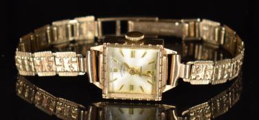 Rotary 9ct gold ladies wristwatch with gold hands and hour markers, silver dial and signed 21