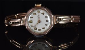 Rolex 9ct gold ladies wristwatch with gold hands and Arabic numerals, silver dial and signed