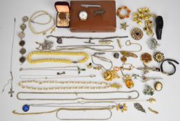 A collection of jewellery including Kenart corgi brooch, other brooches including Sarah Coventry and