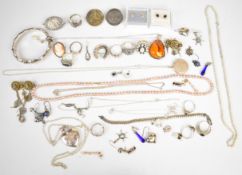 A collection of silver jewellery including bamboo bangle, ten rings, two lockets, cameo brooch, five