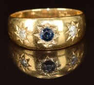 Edwardian 18ct gold ring set with a sapphire and two diamonds in a star setting, Birmingham 1906,
