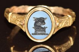 Victorian mourning ring set with an agate intaglio, with locket section under the ring head and