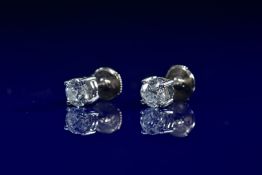 A pair of 18ct white gold earrings each set with a round cut diamond of approximately 0.65ct, 2.9g