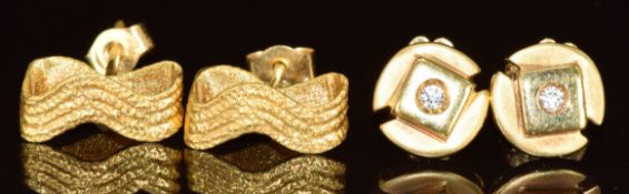 A pair of 14k gold earrings each set with a diamond (2.5g) and a pair of 18ct gold earrings (1.5g)