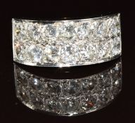 An 18ct gold ring set with fourteen round cut diamonds in a white metal setting, each