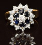 A 9ct gold ring set with diamonds and sapphires in a cluster, 4.5g, size O