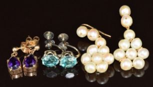 A pair of 9ct white gold earrings each set with a round cut zircon, a pair of 9ct gold earrings