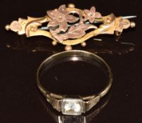 A 14k gold ring set with quartz (2.1g, size W) and a 9ct gold brooch (3.9cm, 1.9g)