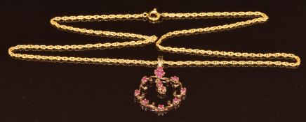 A 9ct gold pendant set with rubies, on 9ct gold chain, 5.8g, 49cm, 3.4cm