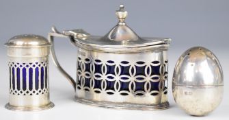 Hallmarked silver mustard, similar pepper and an egg shaped hallmarked silver pepper, length of