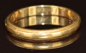 An 18ct gold wedding band/ ring by T & Co.