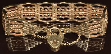 A 9ct gold gate bracelet with heart padlock clasp, 37.8g, 19cm