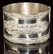 A silver bangle with buckle decoration, possibly Maltese, 44.1g