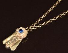 A 14k gold pendant set with a synthetic sapphire (4.6g) on a 9ct gold chain, 4.2g, 44cm