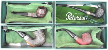 Four Peterson smoking pipes comprising 125th Anniversary, Pipenotes 2023, Sherlock Holmes Rusticated