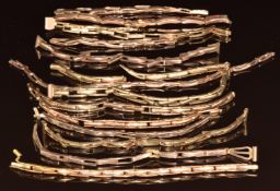 Eight 9ct gold watch straps (40g) and sections of 9ct gold watch straps (17.3g)