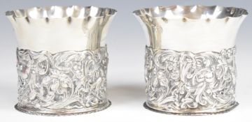 Pair of Victorian hallmarked silver wine coasters with embossed decoration of birds amongst foliage,