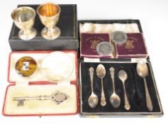 Two hallmarked silver egg cups, five various hallmarked silver spoons, 900 grade silver bracelet,