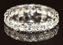 An 18ct white gold eternity ring set with spinel, 4.2g, size Q