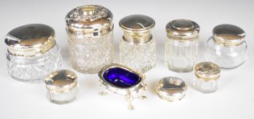 Seven various hallmarked silver lidded dressing table bottles, further loose lid and a hallmarked