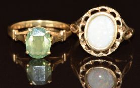An 18k gold ring set with tourmaline (2.8g, size N) and a 9ct gold ring set with an opal (2.2g, size