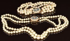 A double strand cultured pearl necklace with matching bracelet, both with 9ct gold clasps set with