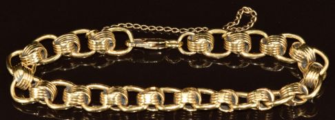 An 18k gold bracelet made up of knotted and oval links with 14k gold clasp, 38.4g, 19cm