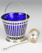 Edward VII hallmarked silver swing handled basket with blue glass liner and matching ladle with
