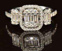 An 18ct white gold ring set with baguette and round cut diamonds, the total diamond weight